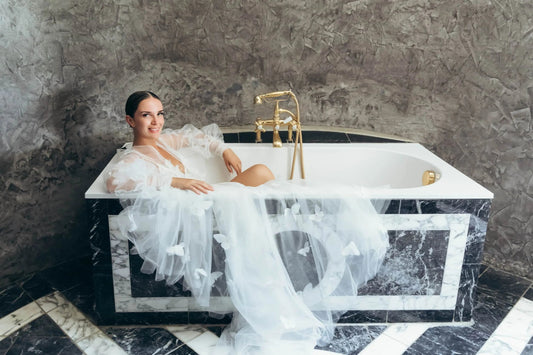 A bride wearing a delicate bridal robe adorned with hand-sewn butterflies, capturing the essence of elegance and whimsy.